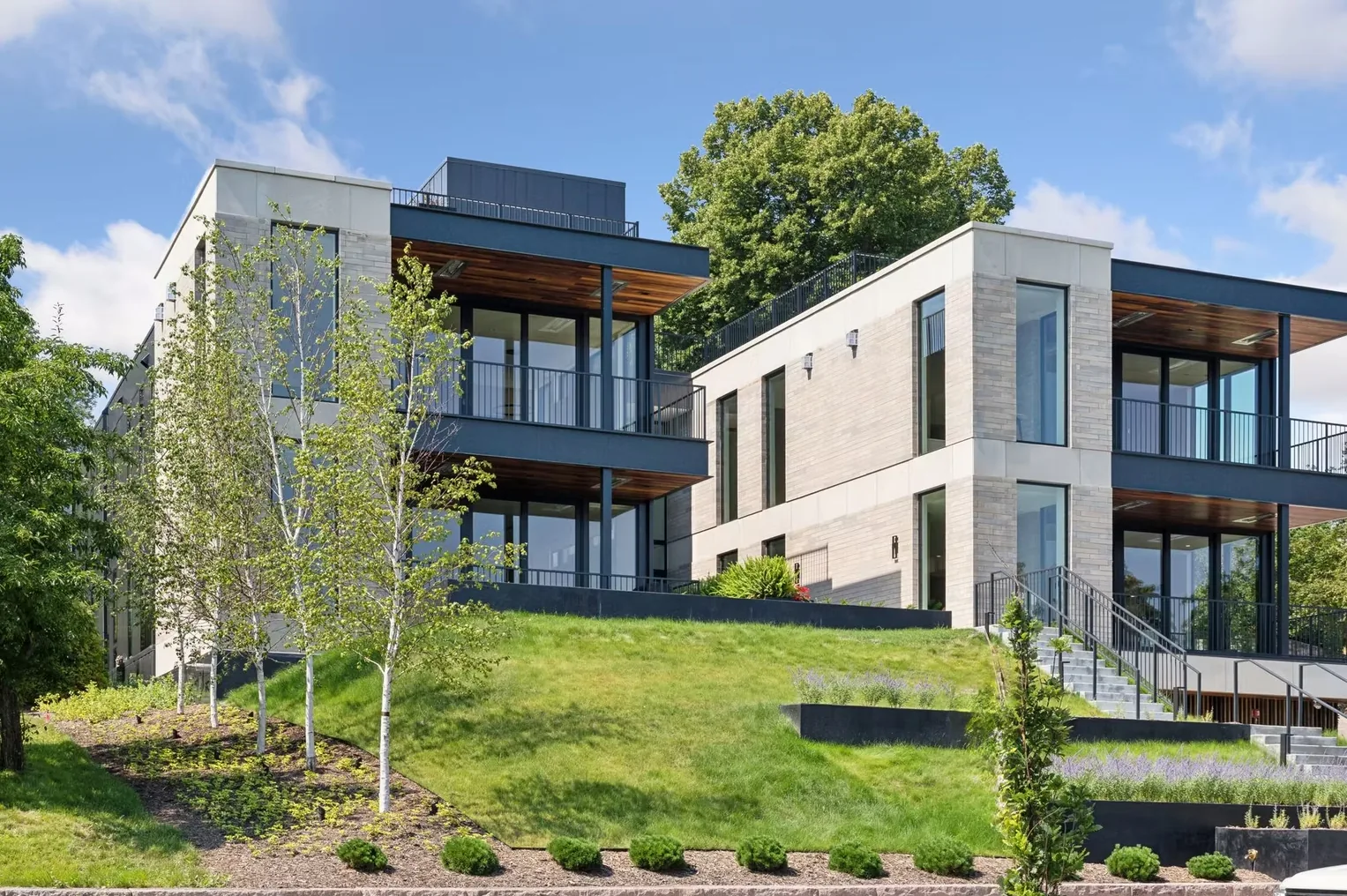 35 Groveland — exterior of the condominium building on a landscaped hillside